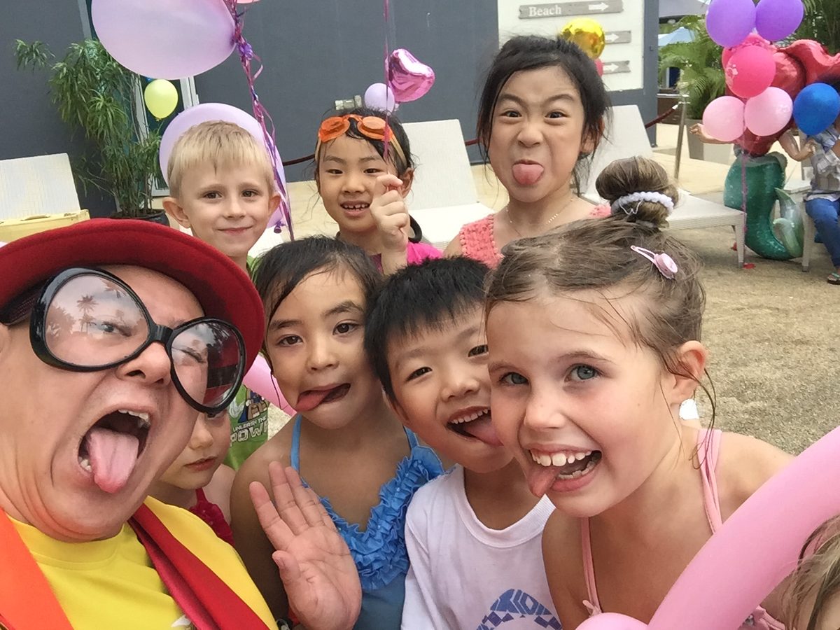 Poolside party crew pulling faces with Maddie